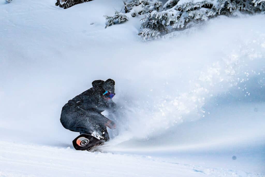 Snowboarder on a powder day at Arizona Snowbowl.