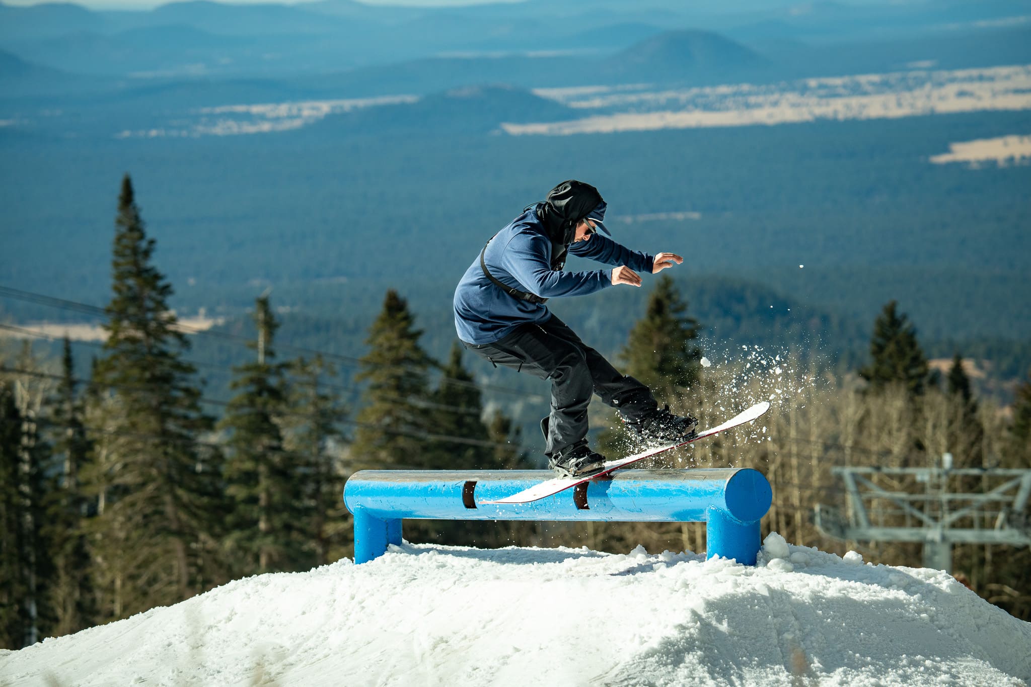Snowboarder hitting rail at Arizona Snowbowl
