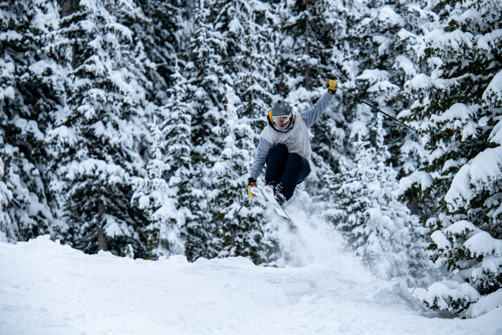 Skier jumping in powder at Arizona Snowbowl