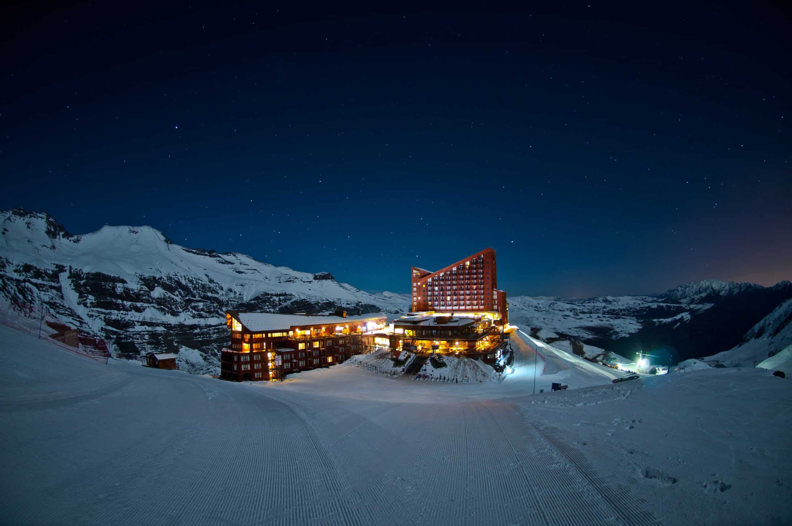 View of Valle Nevado hotel at night from the ski run