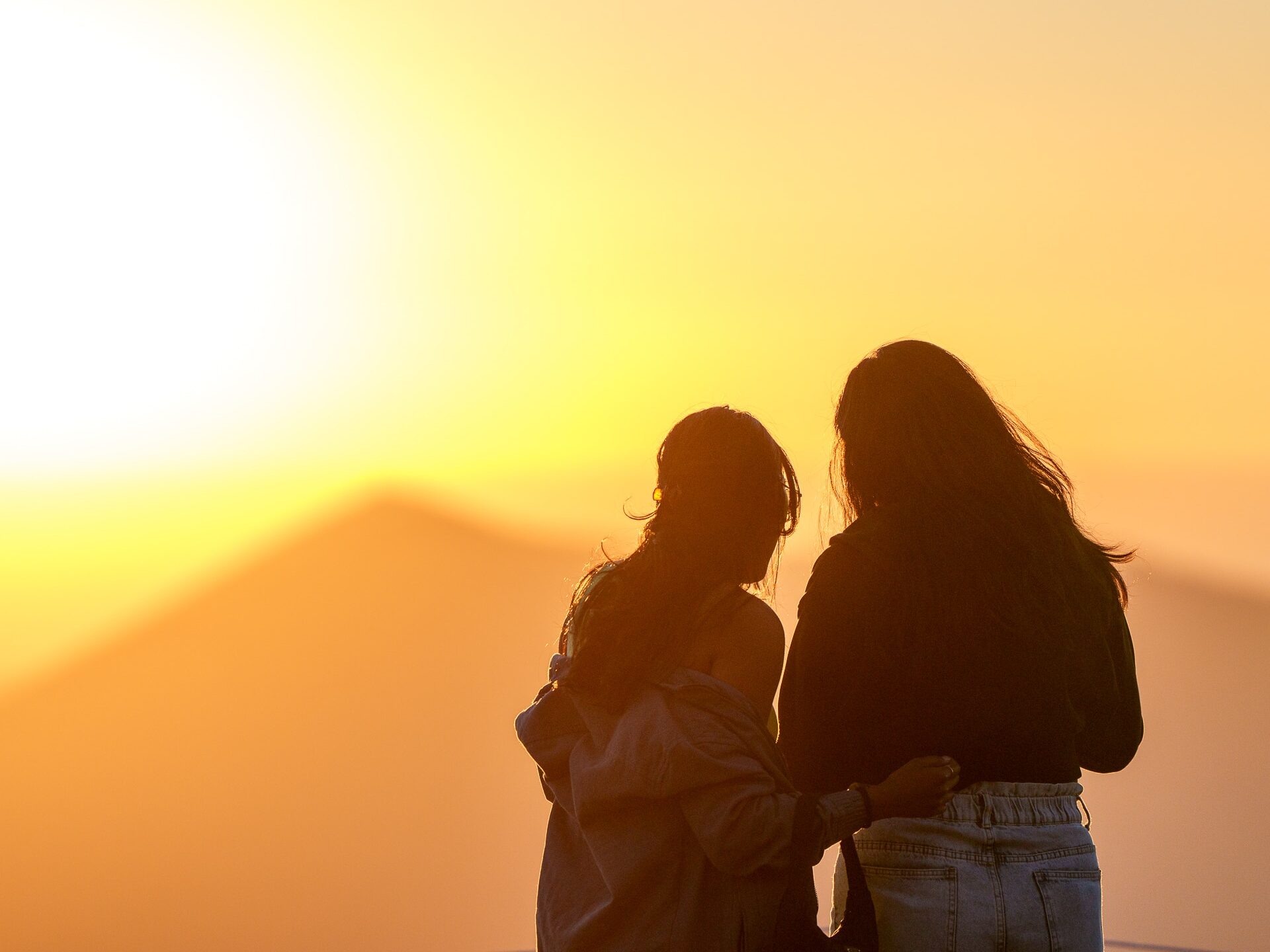 Two girls admiring sunset