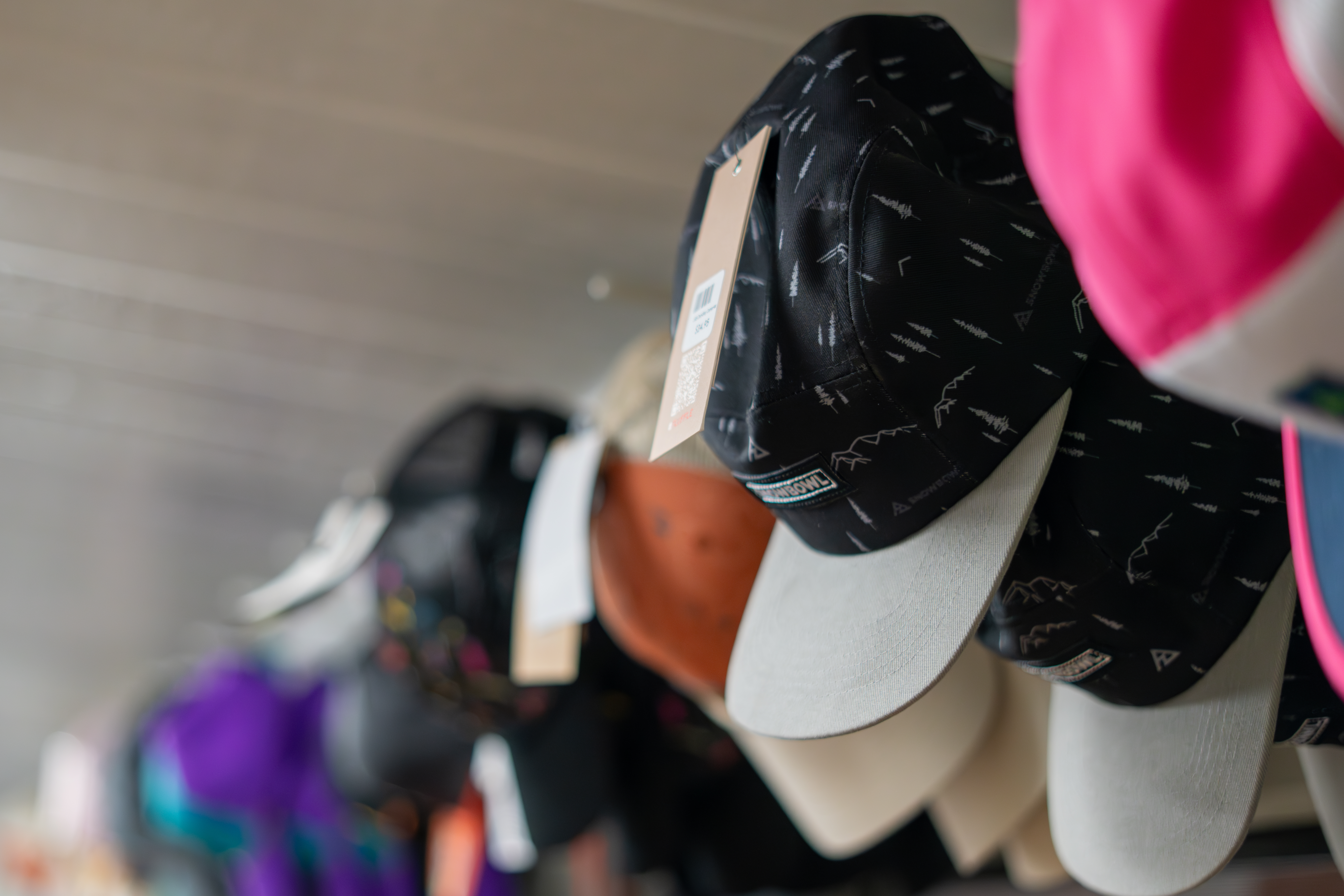 Collection of Snowbowl hats in the Agassiz Retail Shop
