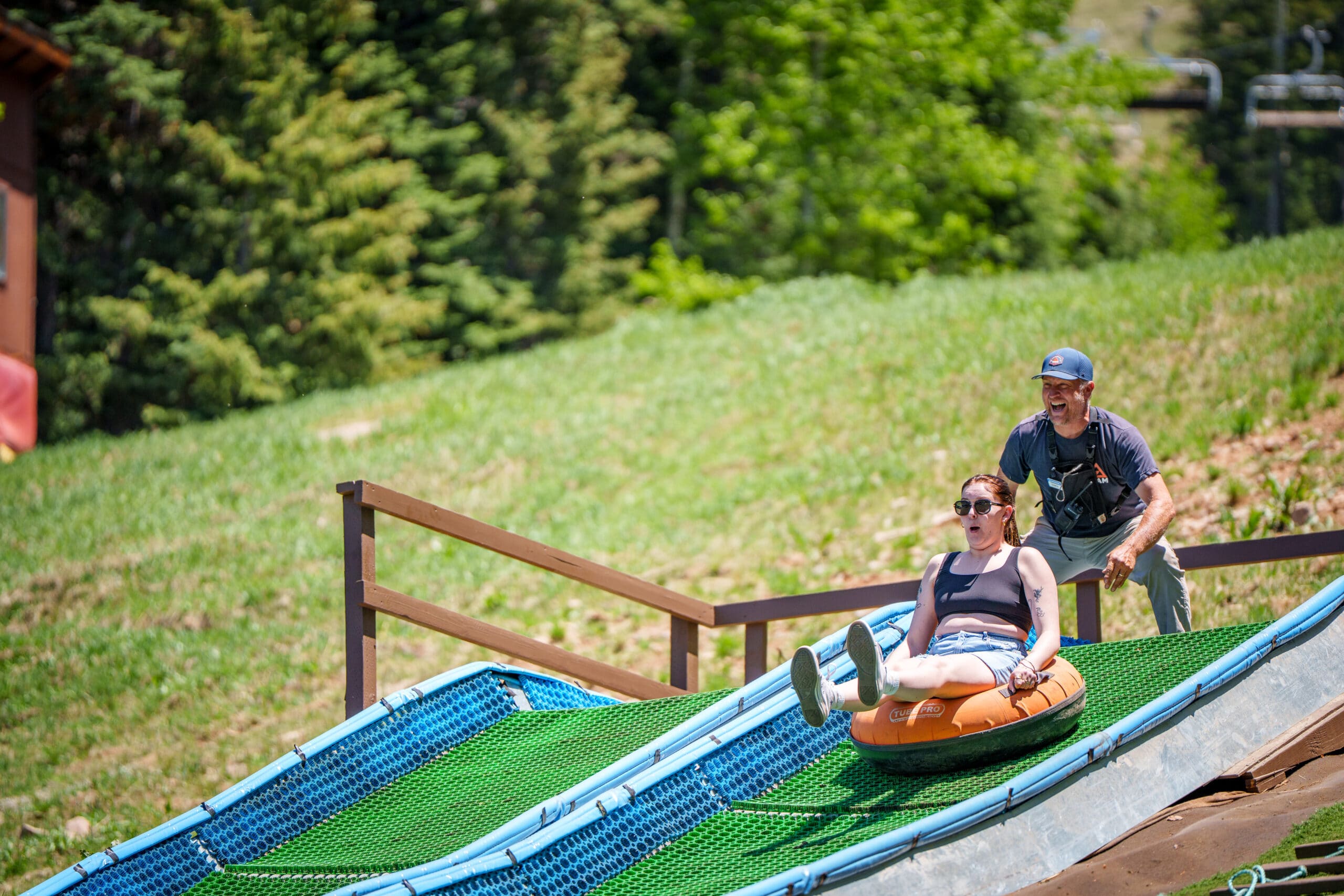 Guest riding down the tubing hill