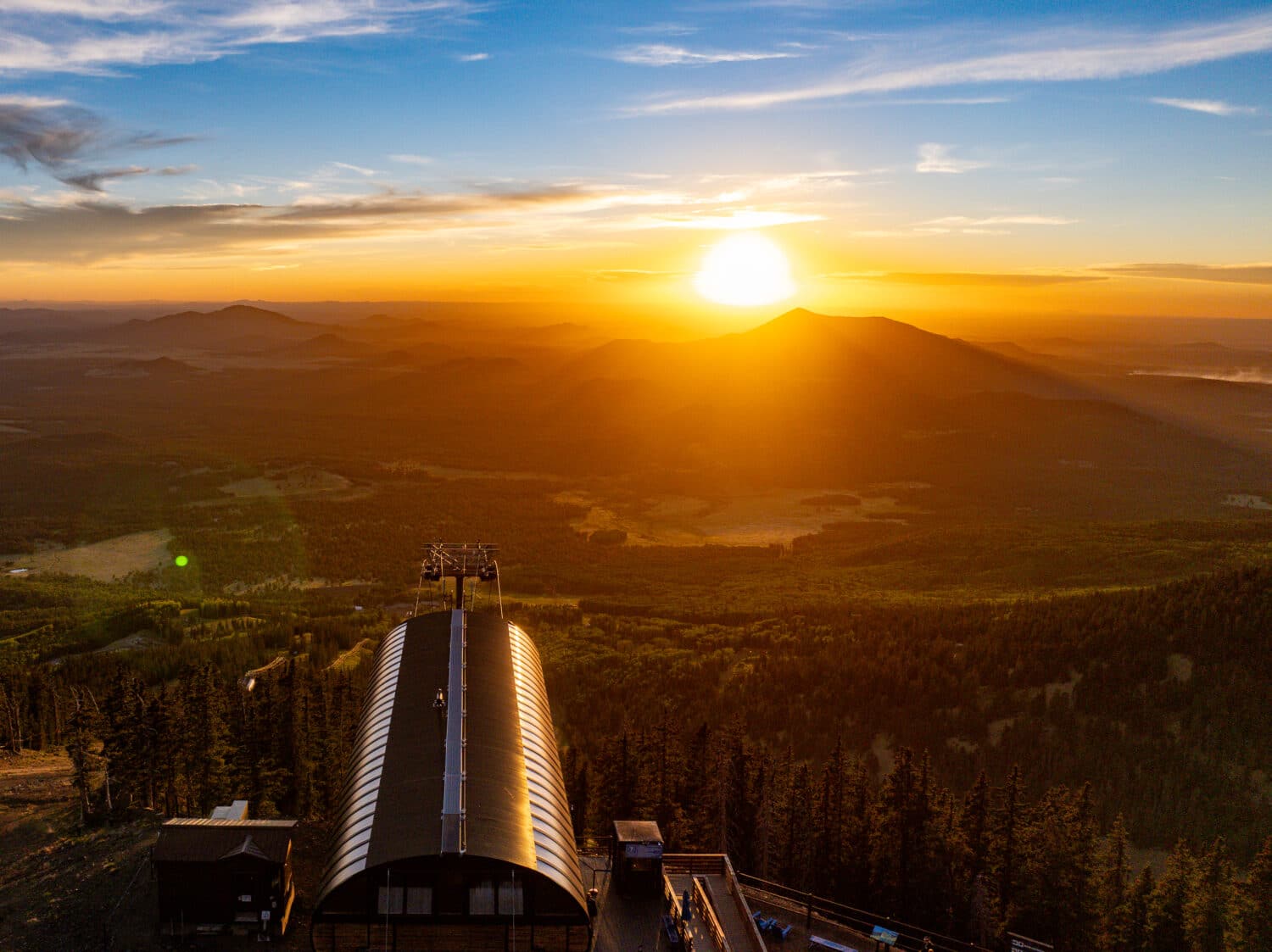 Sun setting over the horizon from the top of Arizona Snowbowl