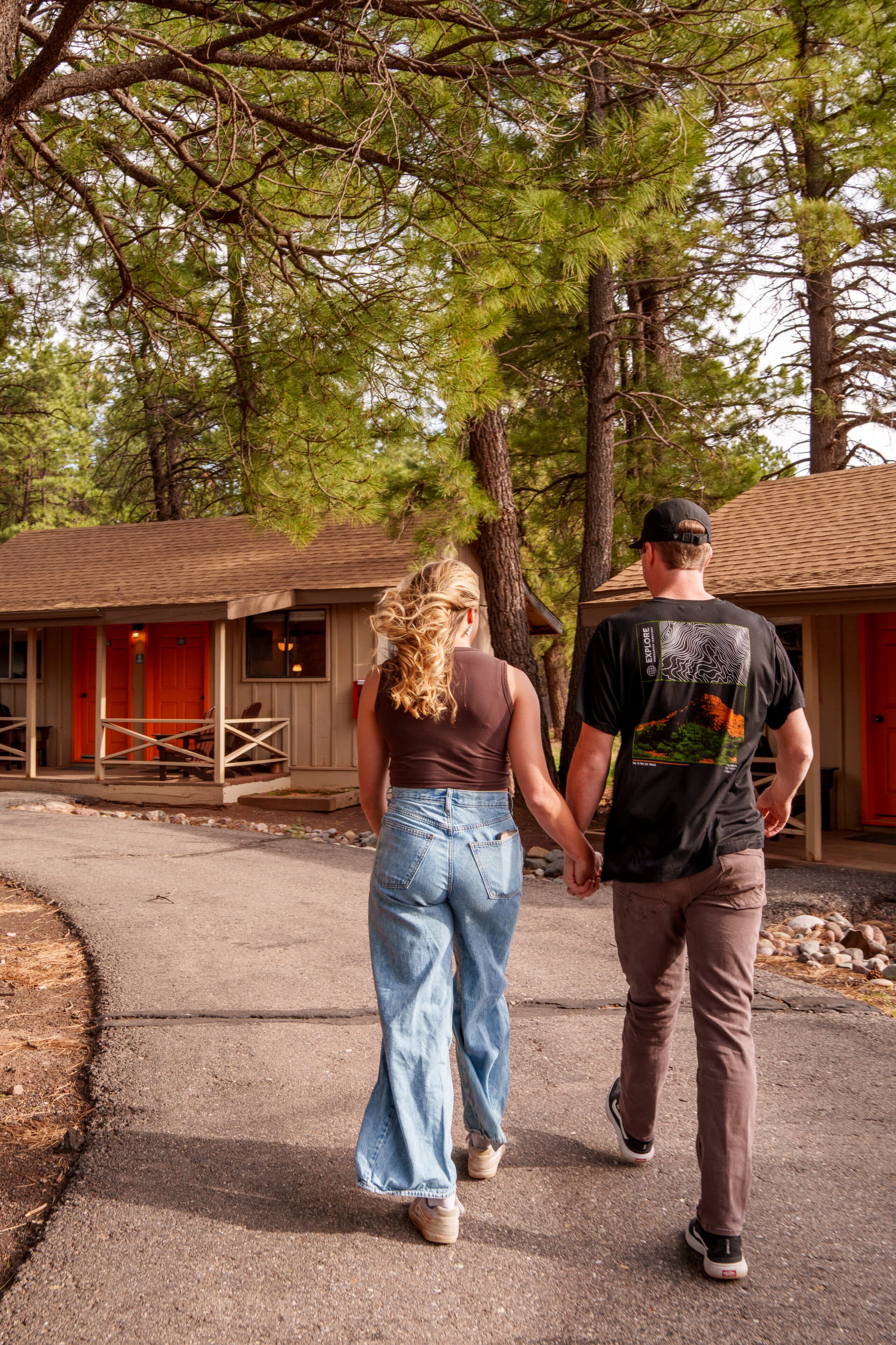 A couple at Basecamp at Snowbowl going to their cabin