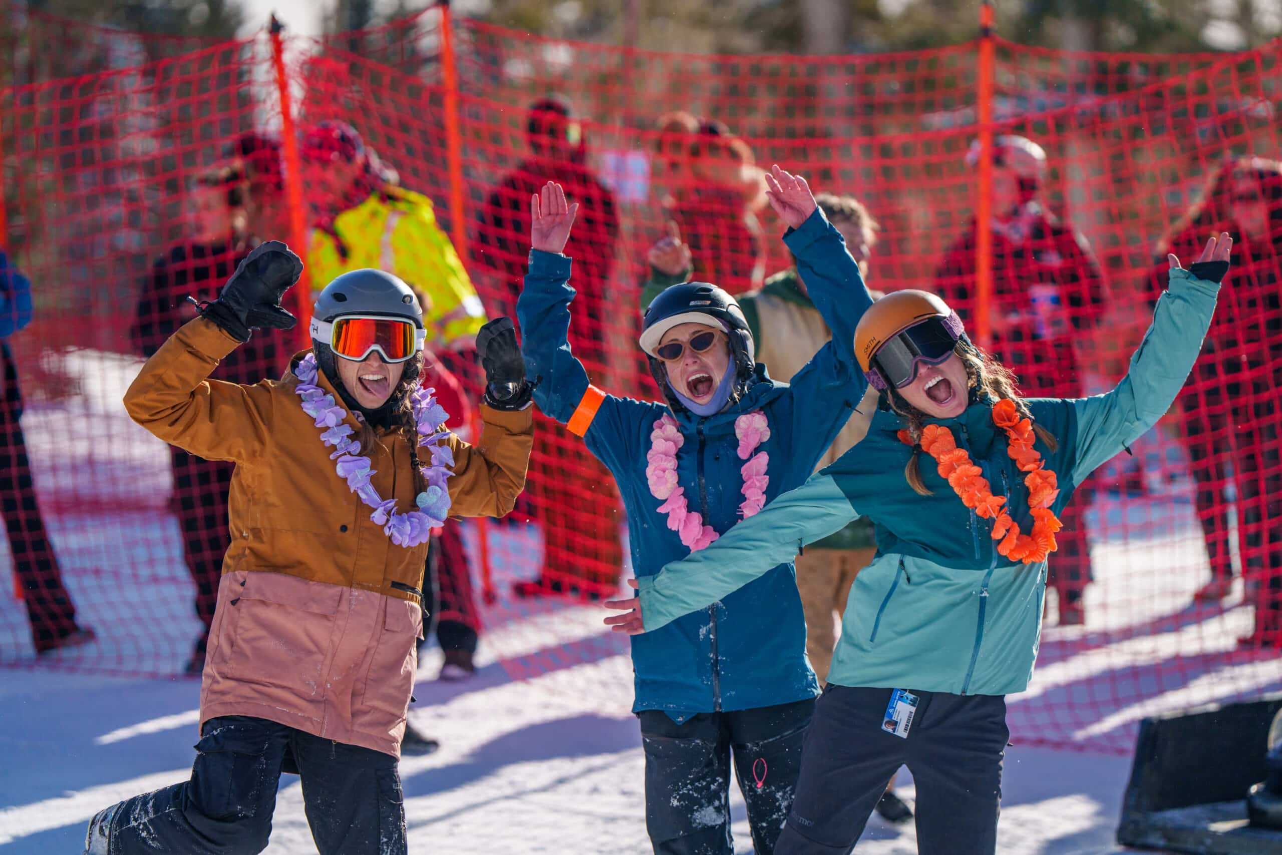 A group of three cheering at Snowbowl