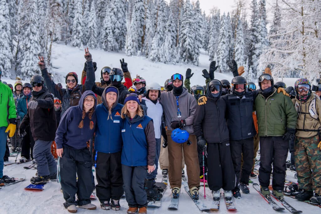 Group of skiers and riders and lift operations employees waiting for first chair, 2025/26