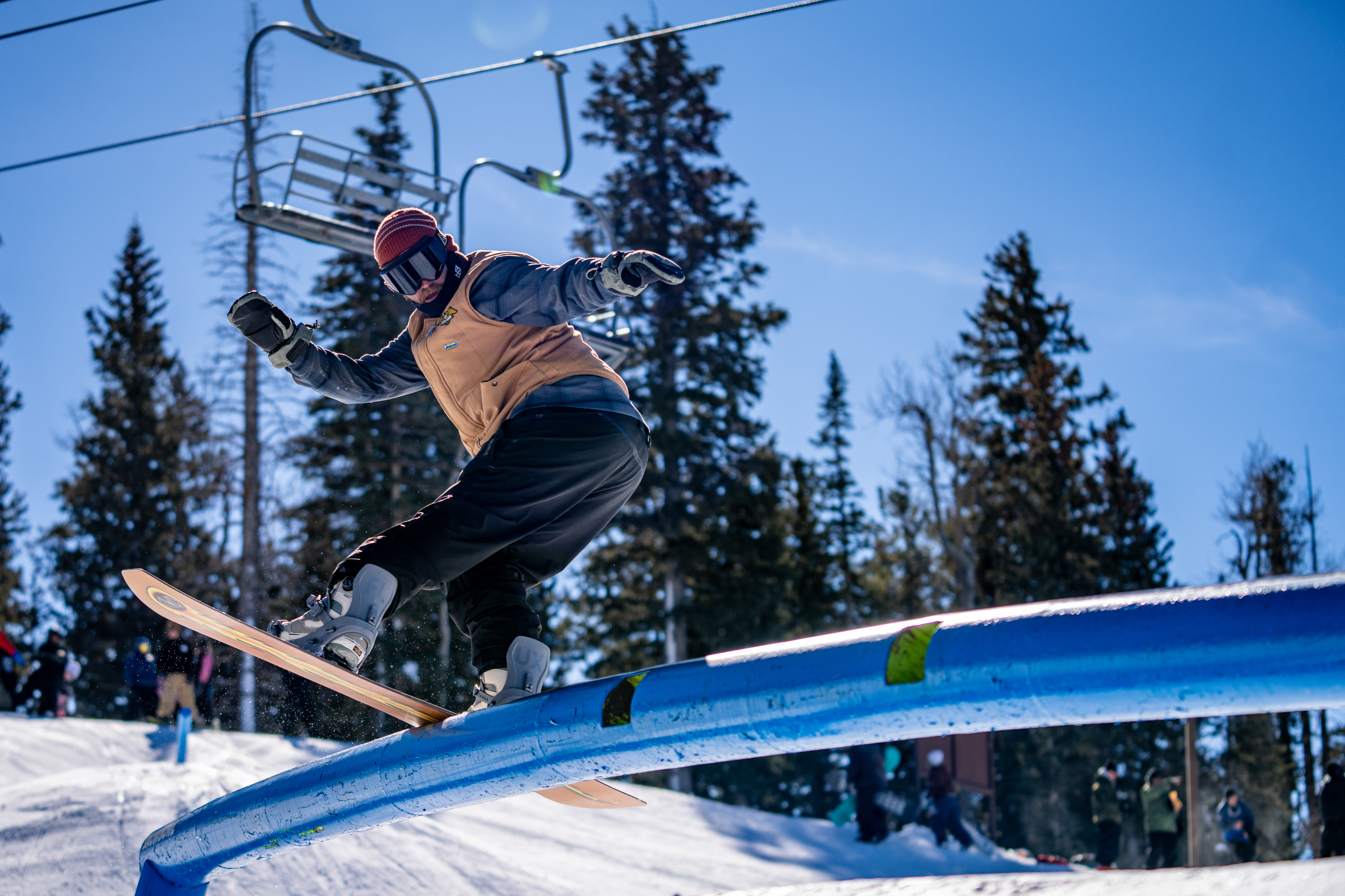 Snowboarder on a rail at Snowbowl