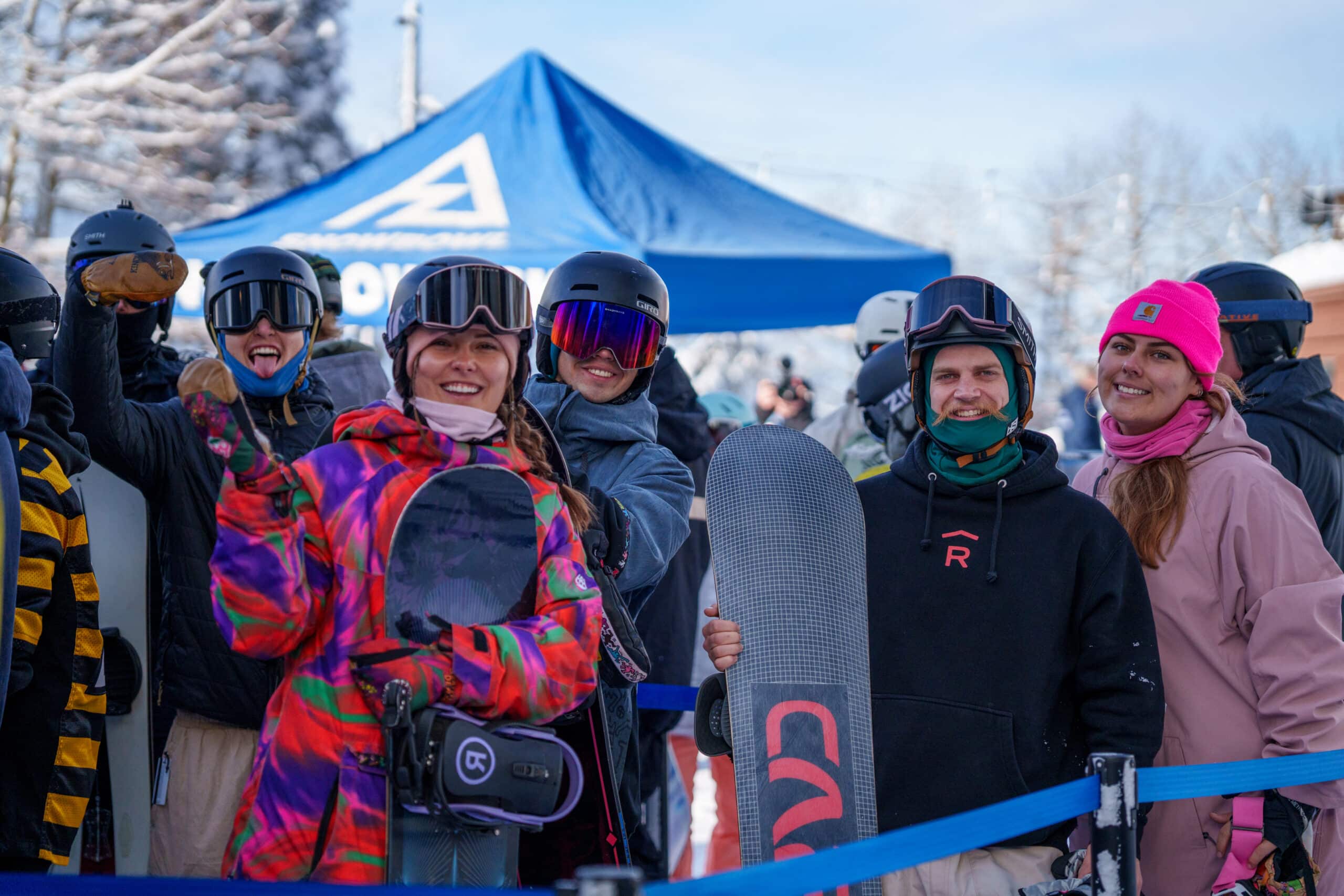 A group of friends in the chairlift line at Snowbowl