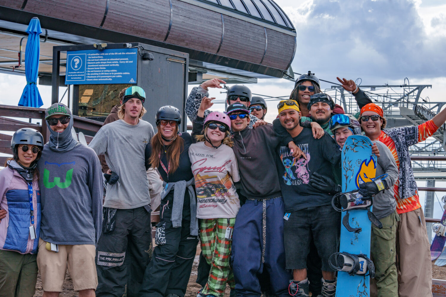 A group of skiers and riders at the top of the Arizona Gondola during closing day, 25/26