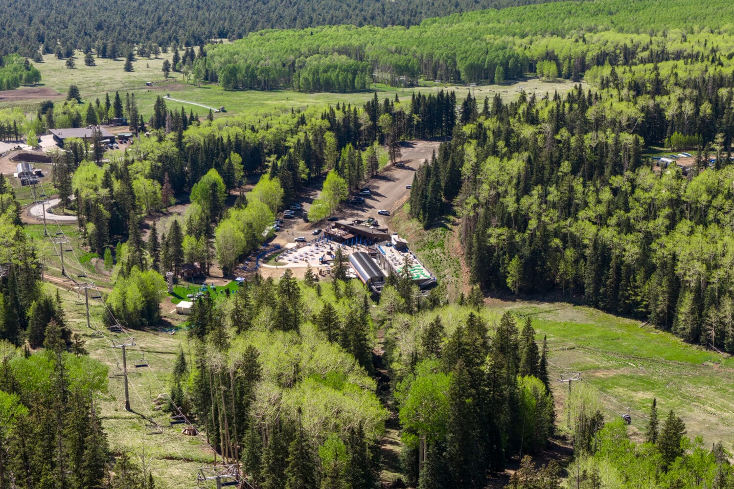Aerial view of the Agassiz Loge base area, green aspens