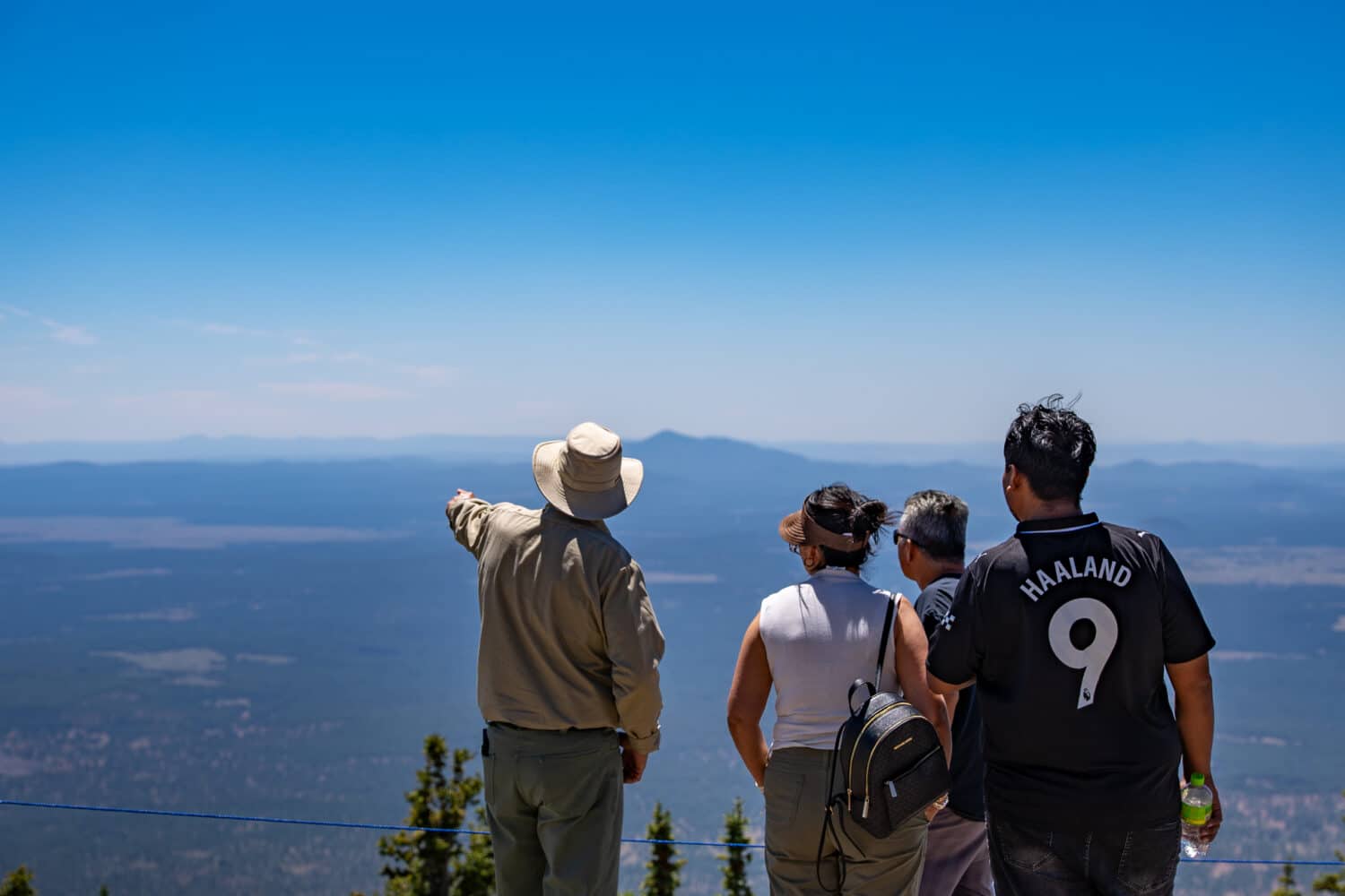 Roving Ranger at the top of the mountain, showing guests the sights